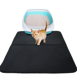 Black honeycomb litter mat beside a cat litter box