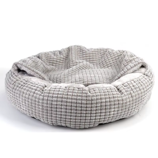 Grey plush donut dog bed with its attached blanket folded over the center