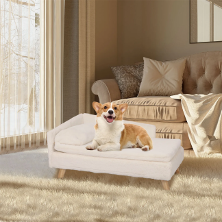 Small dog resting on a cream raised pet sofa